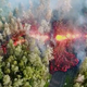 A still image taken from a video shot May 3, 2018 shows magma and steam emerging from a fissure on Hawaii’s Big Island. SO2 is an invisible gas.